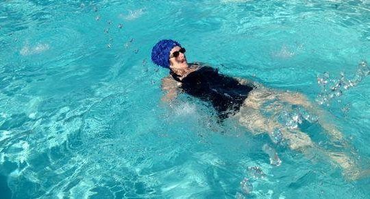 Woman swimming in pool