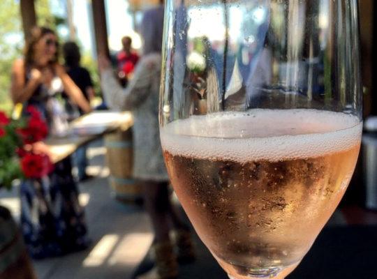 Glass of Wedding Cuvee at a tasting room