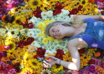 Lady laying in flowers