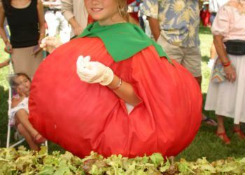 Girl dressed up as a tomato