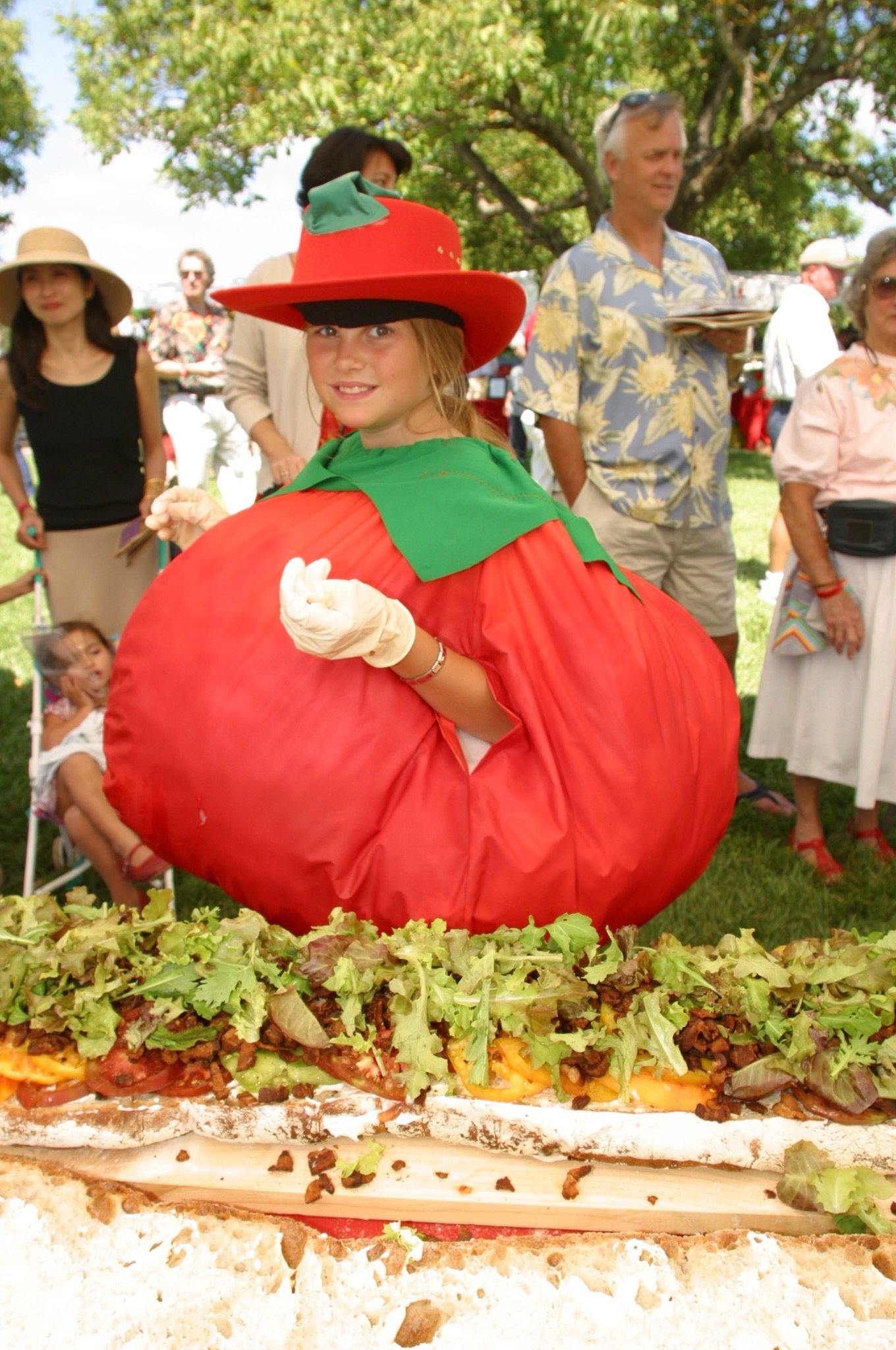 Girl dressed up as a tomato