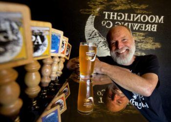 Man pouring craft beer